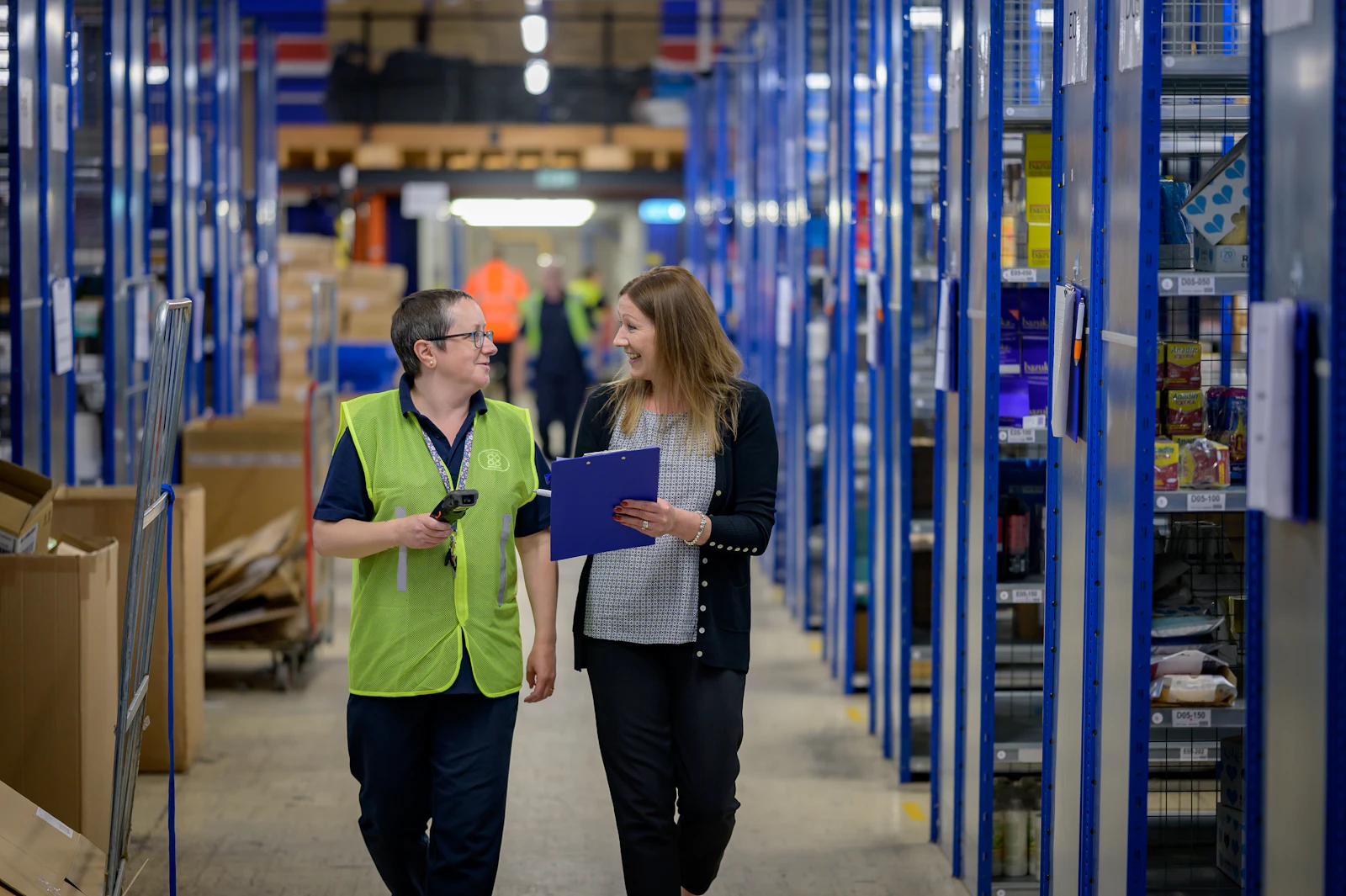 Stockroom aisle with parts bins on blue shelving