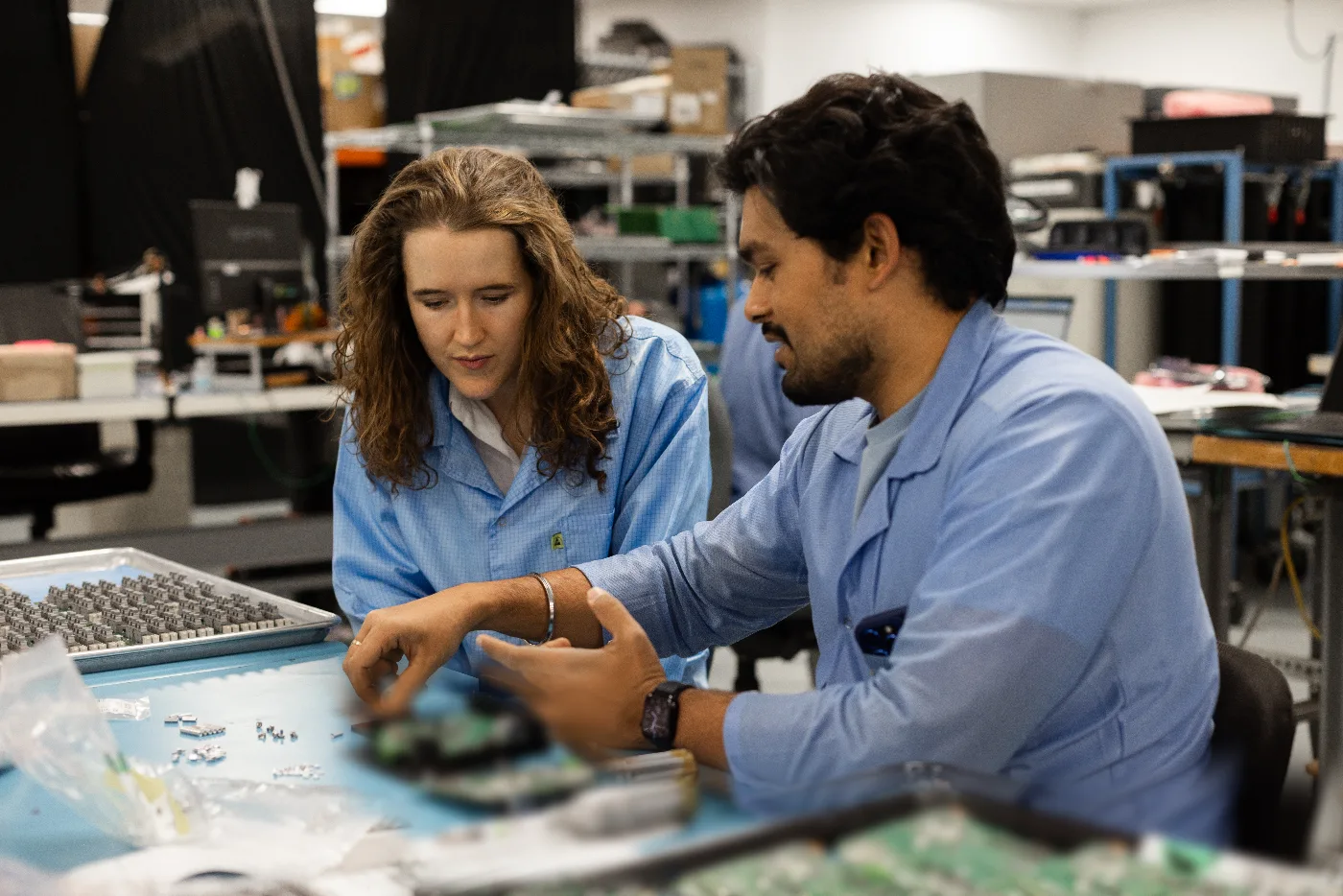 Leyla Sudbury and a BSU engineer working through a board assembly at the bench