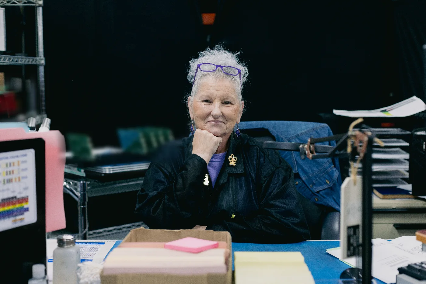 BSU team member at her desk on the production floor